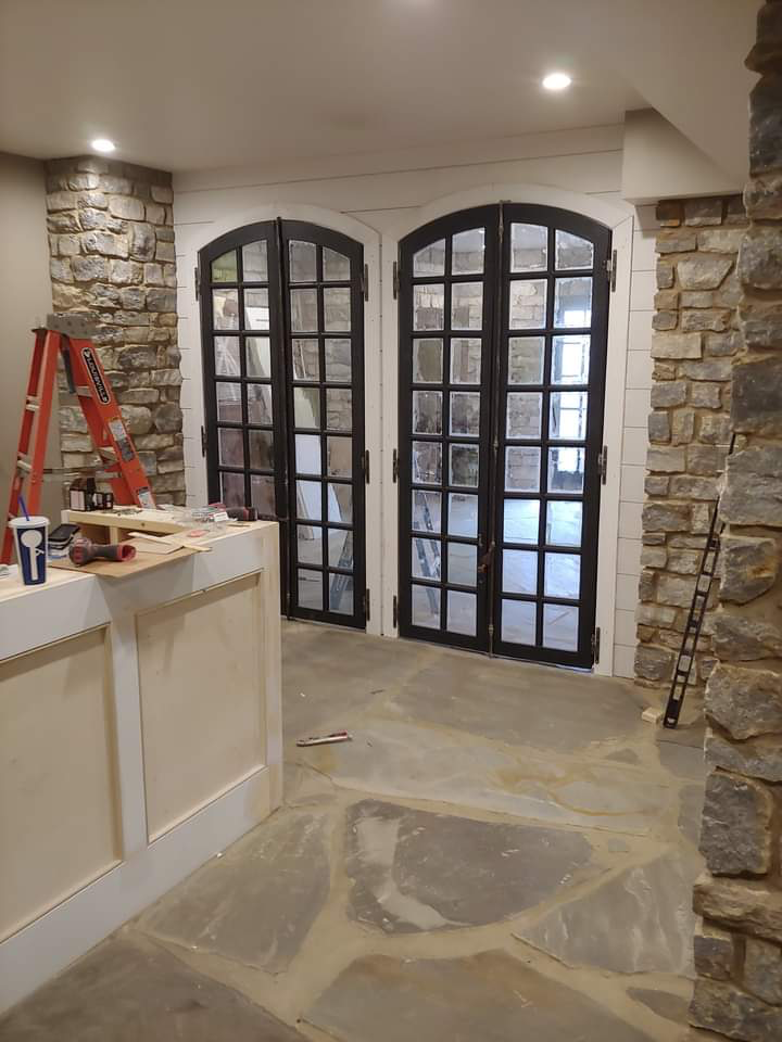 Arched glass double doors with white trim